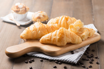 croissant bread on wood plate
