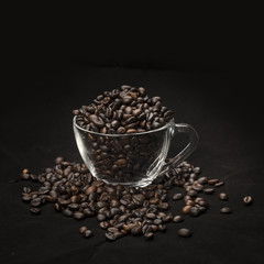 coffee beans in a cup on dark background
