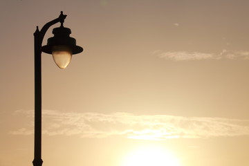 Horizontal image of a street lamp with sky in the background