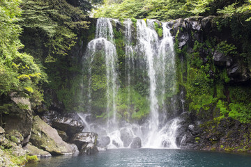 Fototapeta na wymiar Waterfall and blue lake in the Jeju island in South Korea