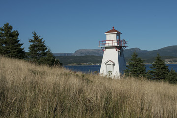 Woody Point Lighthouse at coast, Southeast Brook Falls, Gros Mor © klevit