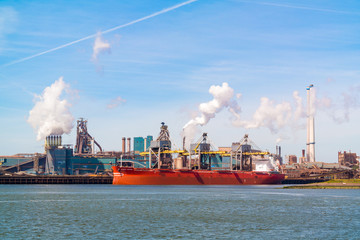 Steel industry plant and North Sea Canal in seaport IJmuiden near Amsterdam in Netherlands