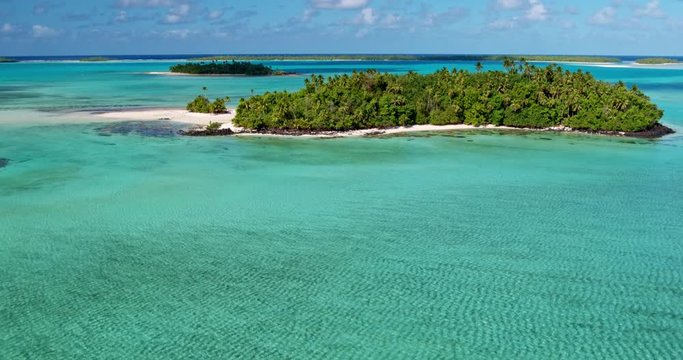 Aerial view of beautiful tropical island lagoon and white sand beach in the South Pacific