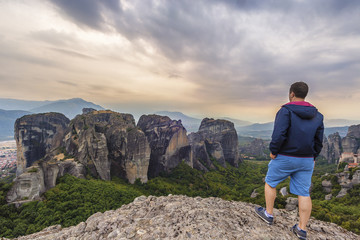 Fototapeta premium Man looking at Meteora phenomenon