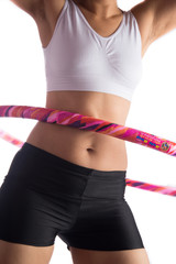 Woman working out with hoola hoop daily excercise at home