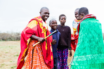 Massai family celebrating and dancing