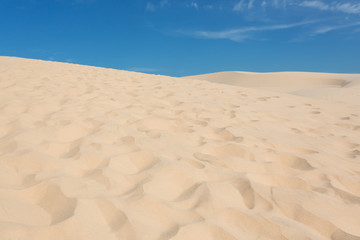 footprint on white sand dune desert in Mui Ne, Vietnam