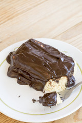 Chocolate cream on the cake with fork