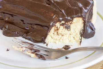 Chocolate cream on the cake with fork