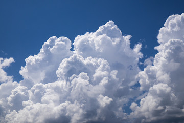 Naklejka na ściany i meble dense white cloud on blue sky