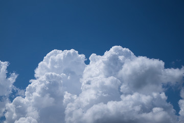 Naklejka na ściany i meble dense white cloud on blue sky