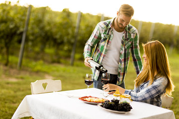 Couple having dinner in vineyard