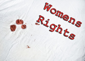 Womans Rights sign on white sheet with blood