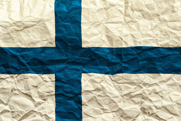 Finland flag. Crumpled paper flag background