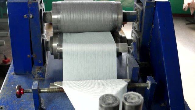 Machine for production of napkins. line machines and tools for the production of napkins and paper towels works. embossing pattern on napkins