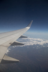 Obraz premium View of jet plane wing
