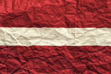 Latvia flag. Crumpled paper flag background