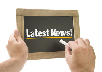 Latest News! - Hand writing on chalkboard