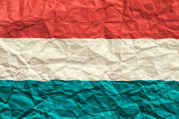 Luxembourg flag. Crumpled paper flag background