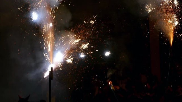 Fire Run (Correfoc) traditional celebration of Catalonia, devils dancing among people with fireworks in the hands to the beat of drums.