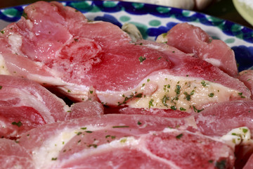 Close-up of turkey cutlets marinated with garlic and parsley