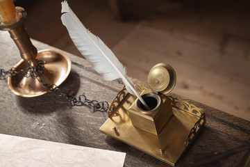 Old writing materials on wooden table