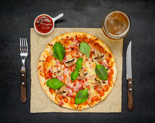 Pizza with Tomato Sauce and Glass of Beer