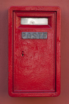 wall red mailbox in Italy, the city of Edolo