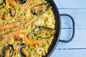 Spanish paella on a wooden table