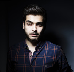 Obraz premium Boy in darkness isolated inside Studio