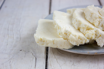 Traditional indian cheese panneer prepared form fresh milk on plate