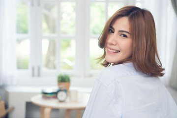 Beauty woman with white perfect smile looking at camera at home