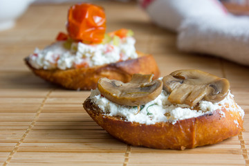 Bruschetta. Delicious and fresh bruschetta with the goat cheese and mushrooms.
