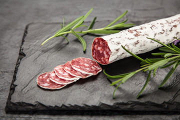 Salami on dark background
