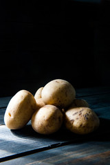 Potatoes in a wood background