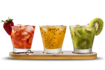 Rolgordijnen Three drinks made with passion fruit, strawberry and kiwi Caipir © paulovilela