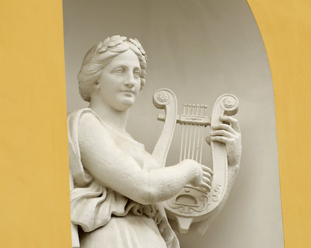 Sculpture of woman with lyre.
