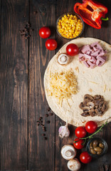 Cooking tortilla wraps with ham, corn, cheese, mushrooms and carrot