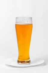 Glass of beer on a plate