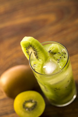 Kiwi Fruit Caipirinha of Brazil on wooden background