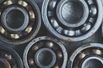Rusty roller bearings on he metal surface