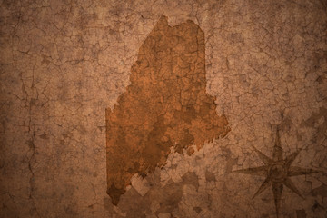 maine state map on a old vintage crack paper background