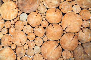 Stacked wood logs background texture