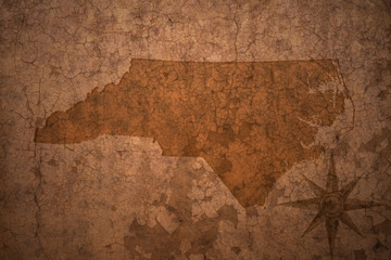 north carolina state map on a old vintage crack paper background