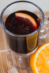 Ingredients for mulled wine: glass orange cinnamon star anise Th