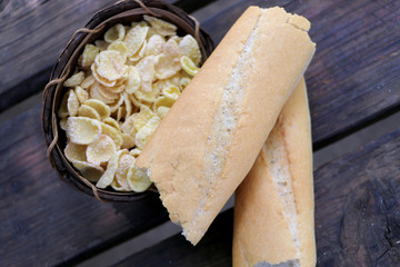 Fototapeta na wymiar baking bread on a wooden table cornflakes,