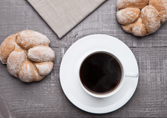 coffee cup with bread roll for breakfast morning
