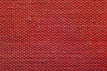 Texture of rough red fabric. Textile background pattern