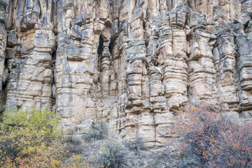 sandstone cliff with columns and pillars