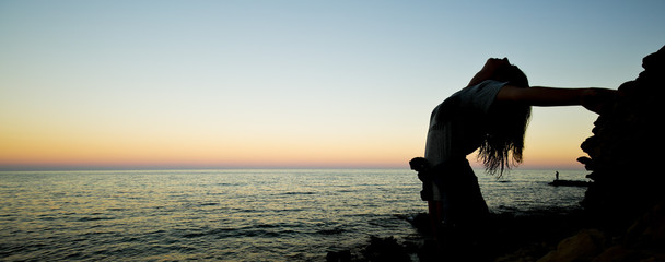 Girl meditating on a beach